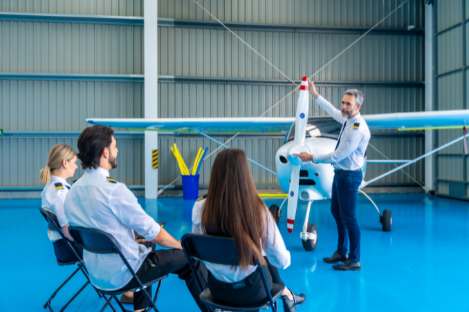 Pilot trainees attending a ground-school aircraft briefing