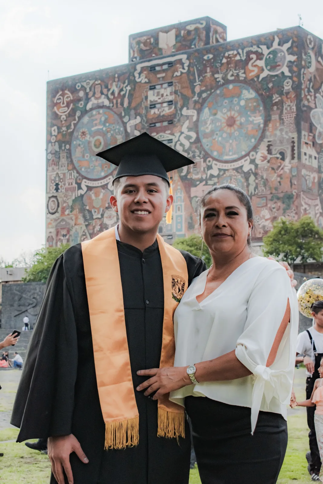 Mother with her son in an academic gown