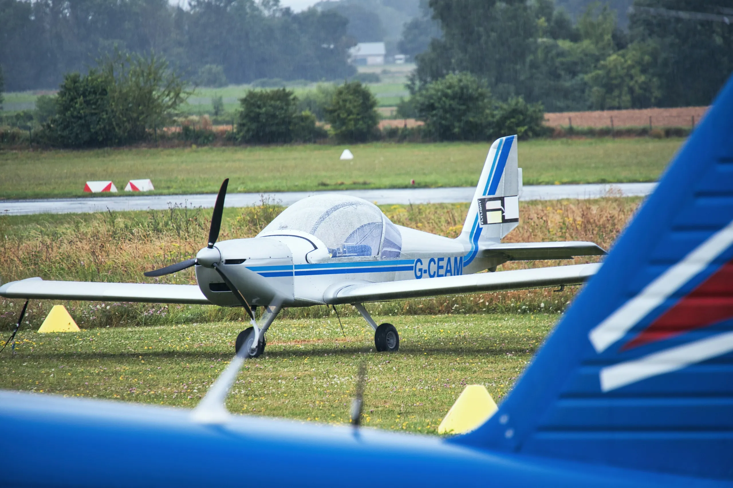 Light training aircraft on a grass airfield