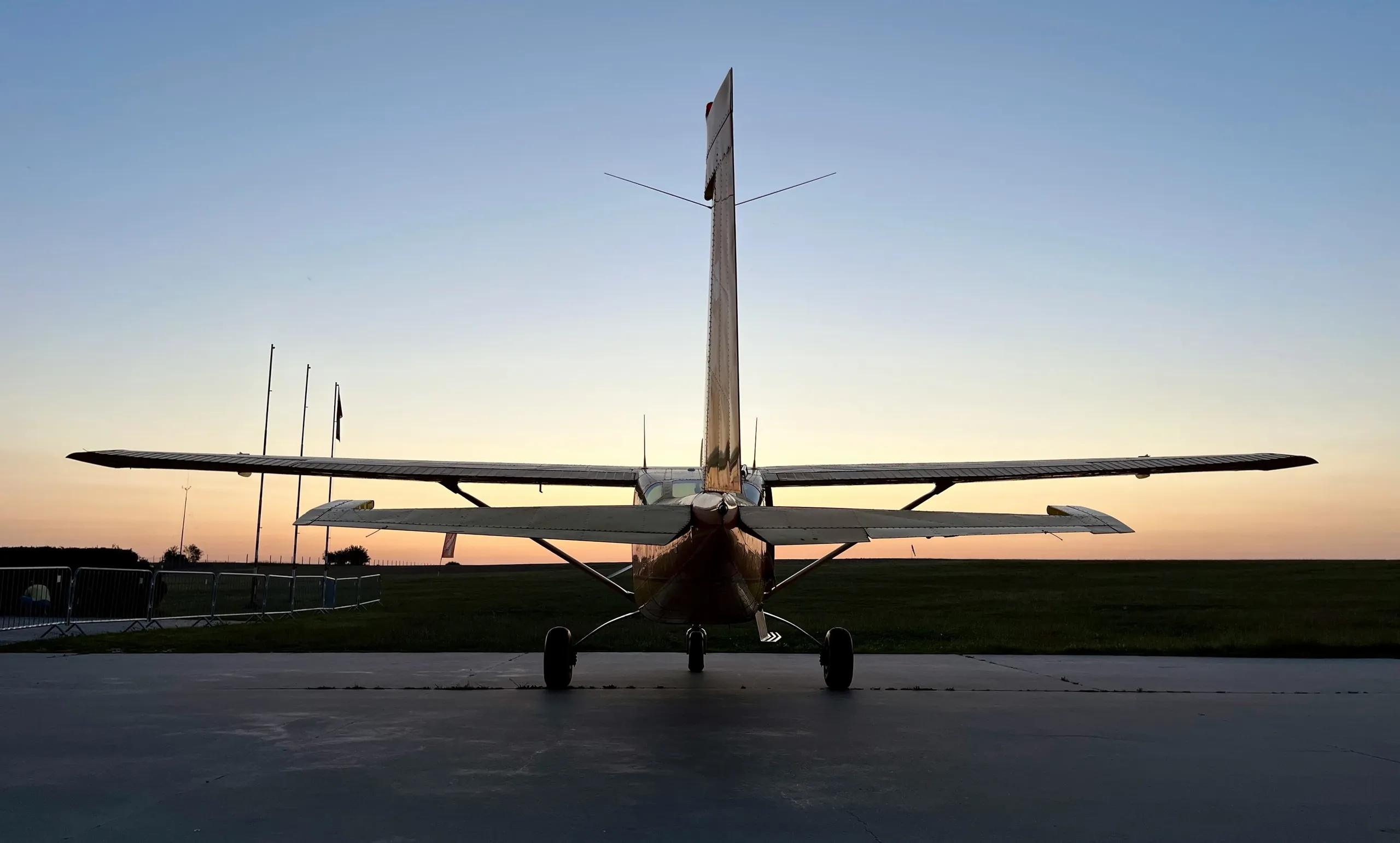Light aircraft on a runway at dusk