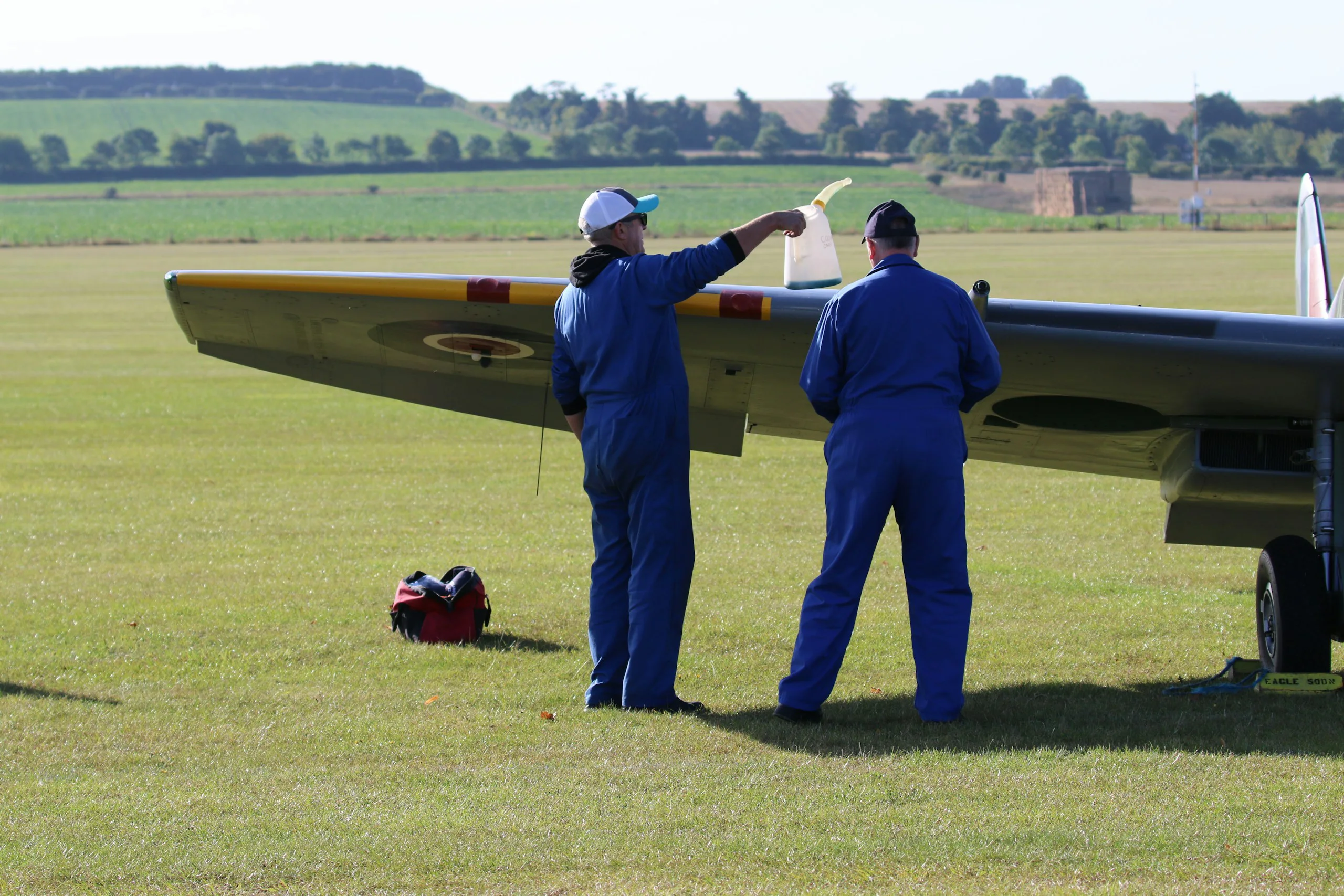 Pre-flight check beside a training aircraft