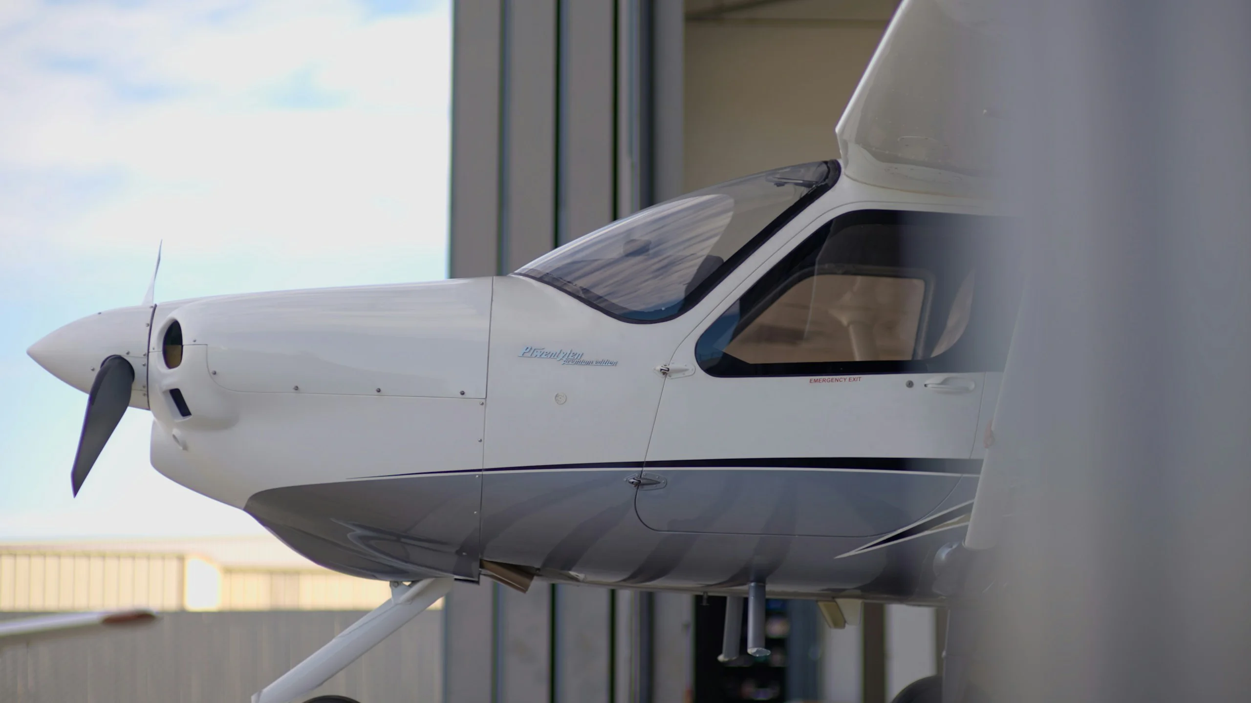 Propeller aircraft in a hangar