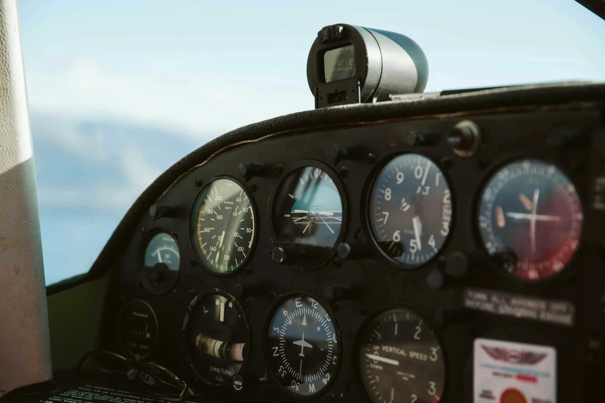Light aircraft instrument panel with a view of the sky
