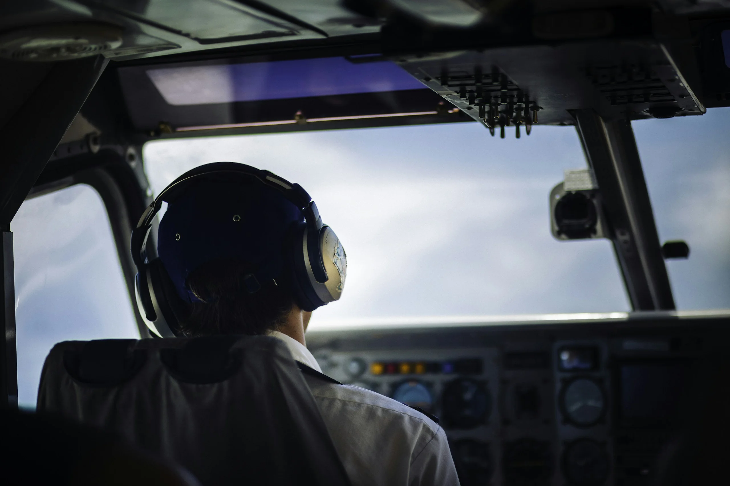 Light aircraft cockpit with a pilot at the controls